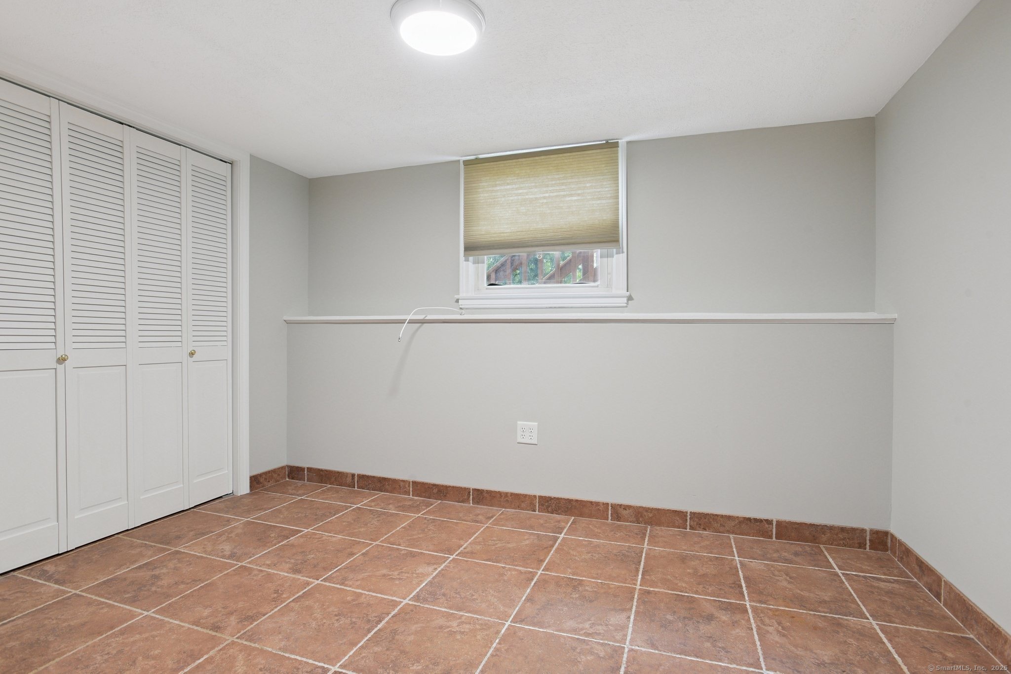 25 Carmen Road Milford, CT 06460 - Photo 11 of 21 a view of an empty room with window and closet area