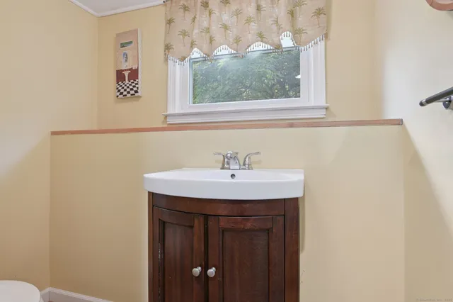 a bathroom with a sink and a window