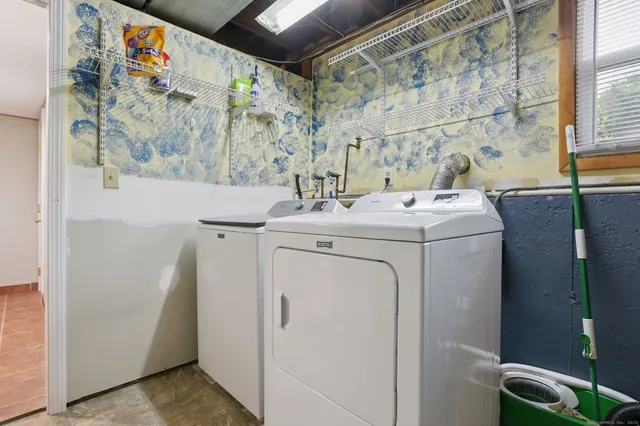 a utility room with dryer and washer