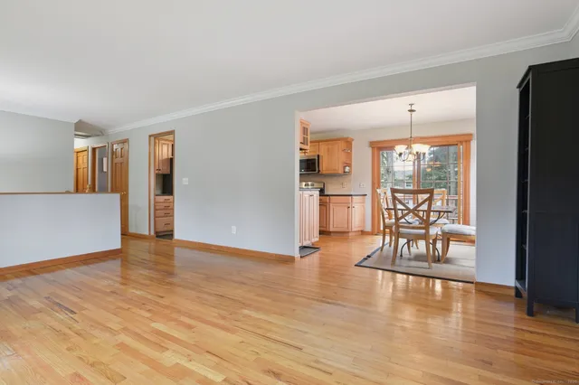 a view of an entryway with wooden floor
