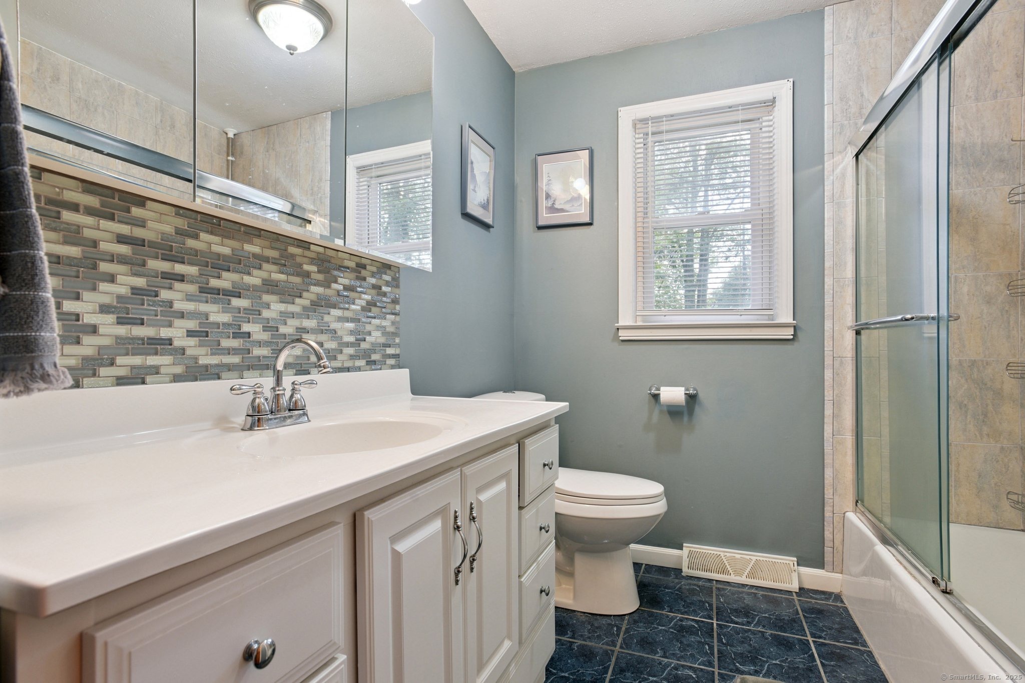25 Carmen Road Milford, CT 06460 - Photo 6 of 21 a bathroom with a sink toilet and shower