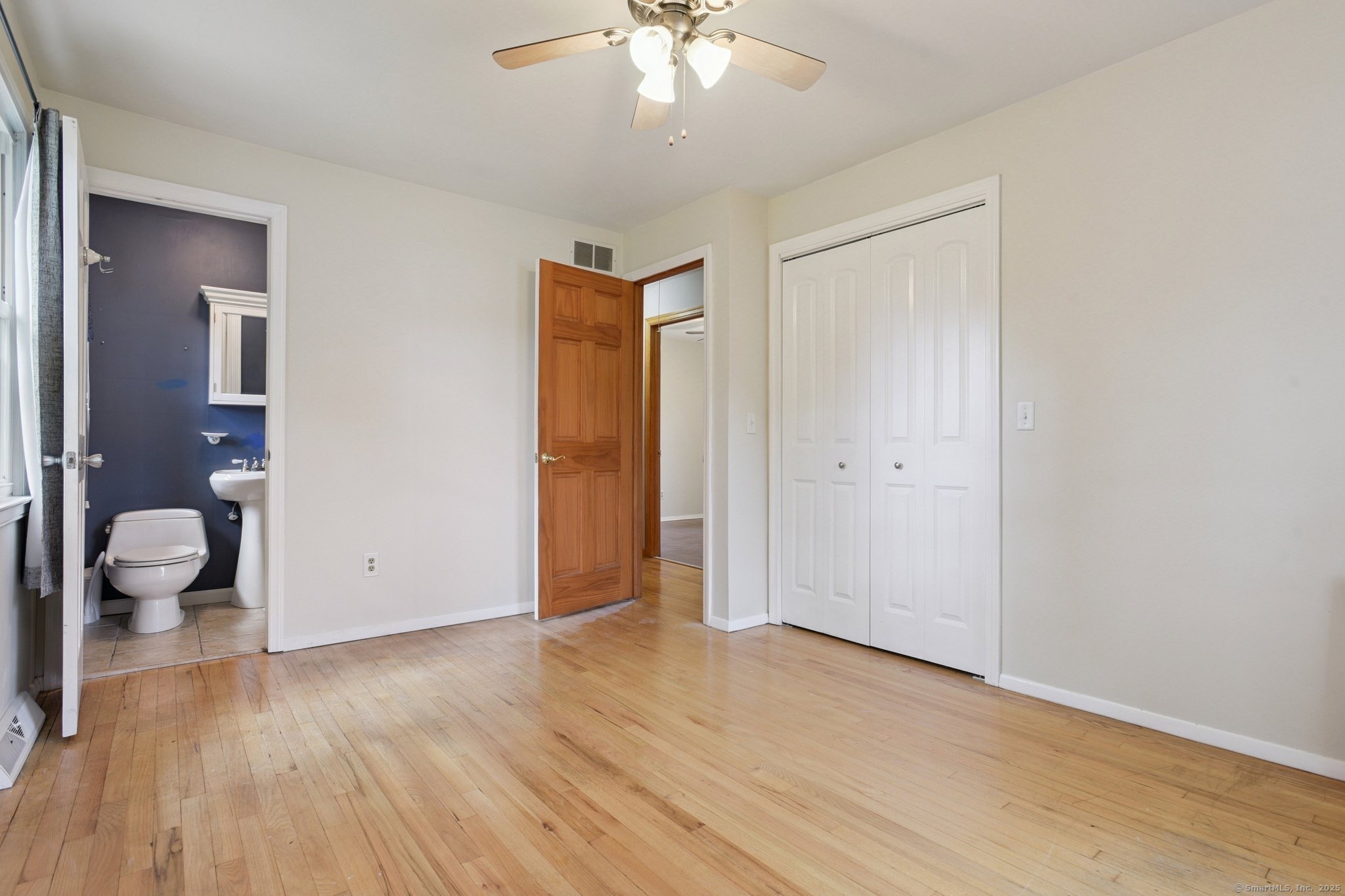 25 Carmen Road Milford, CT 06460 - Photo 9 of 21 a view of a room with wooden floor and window