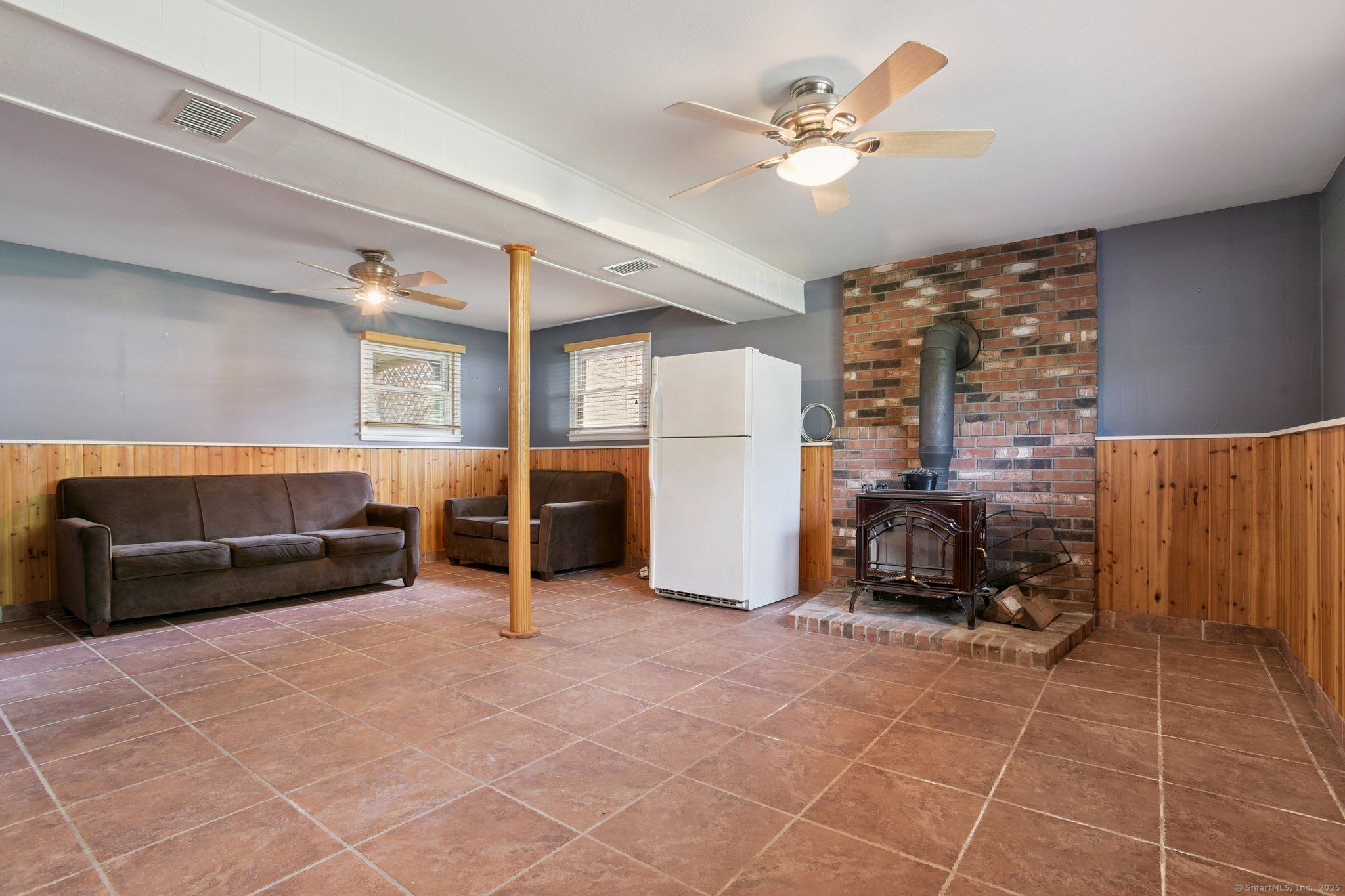 25 Carmen Road Milford, CT 06460 - Photo 10 of 21 a living room with furniture and a chandelier