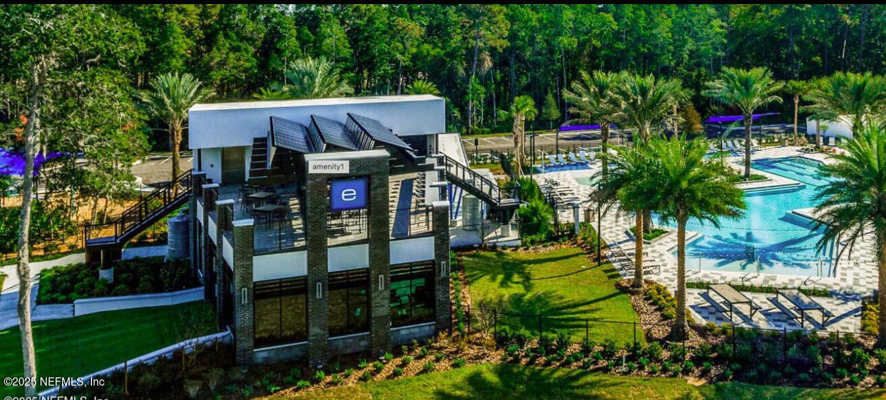 9858 Element Road Jacksonville, FL 32256 - Photo 16 of 19 a view of house with swimming pool and green space