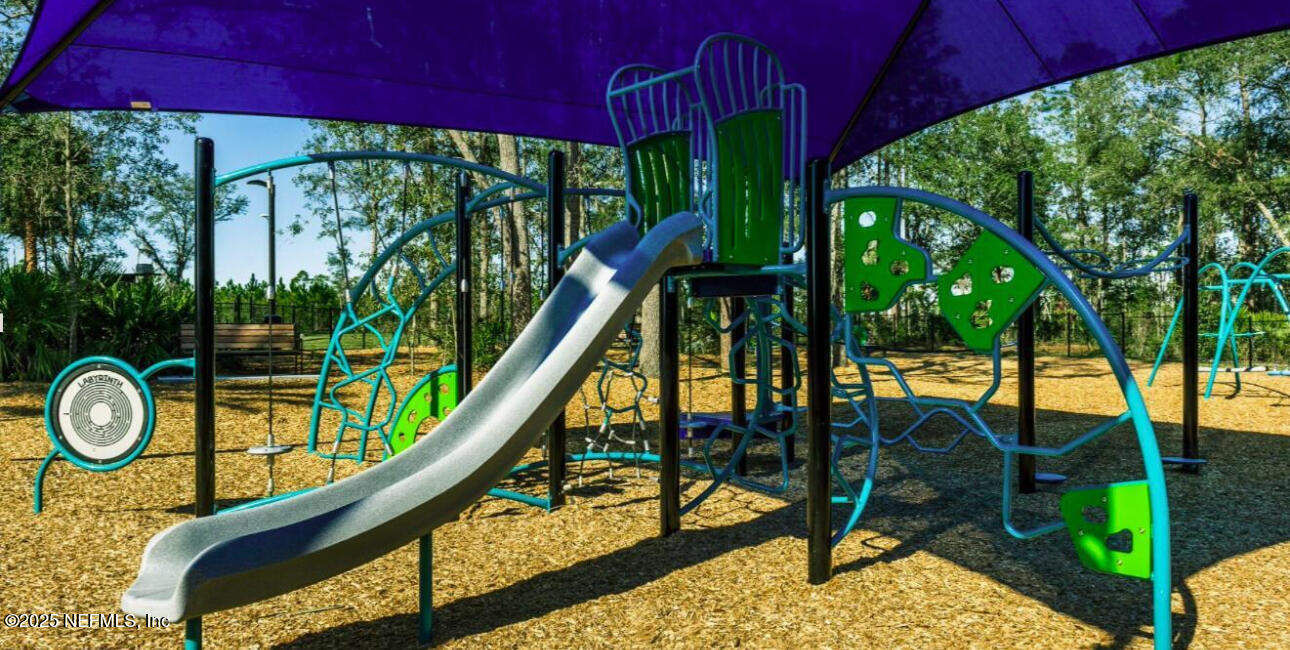 9858 Element Road Jacksonville, FL 32256 - Photo 18 of 19 a park with large trees and a wooden fence