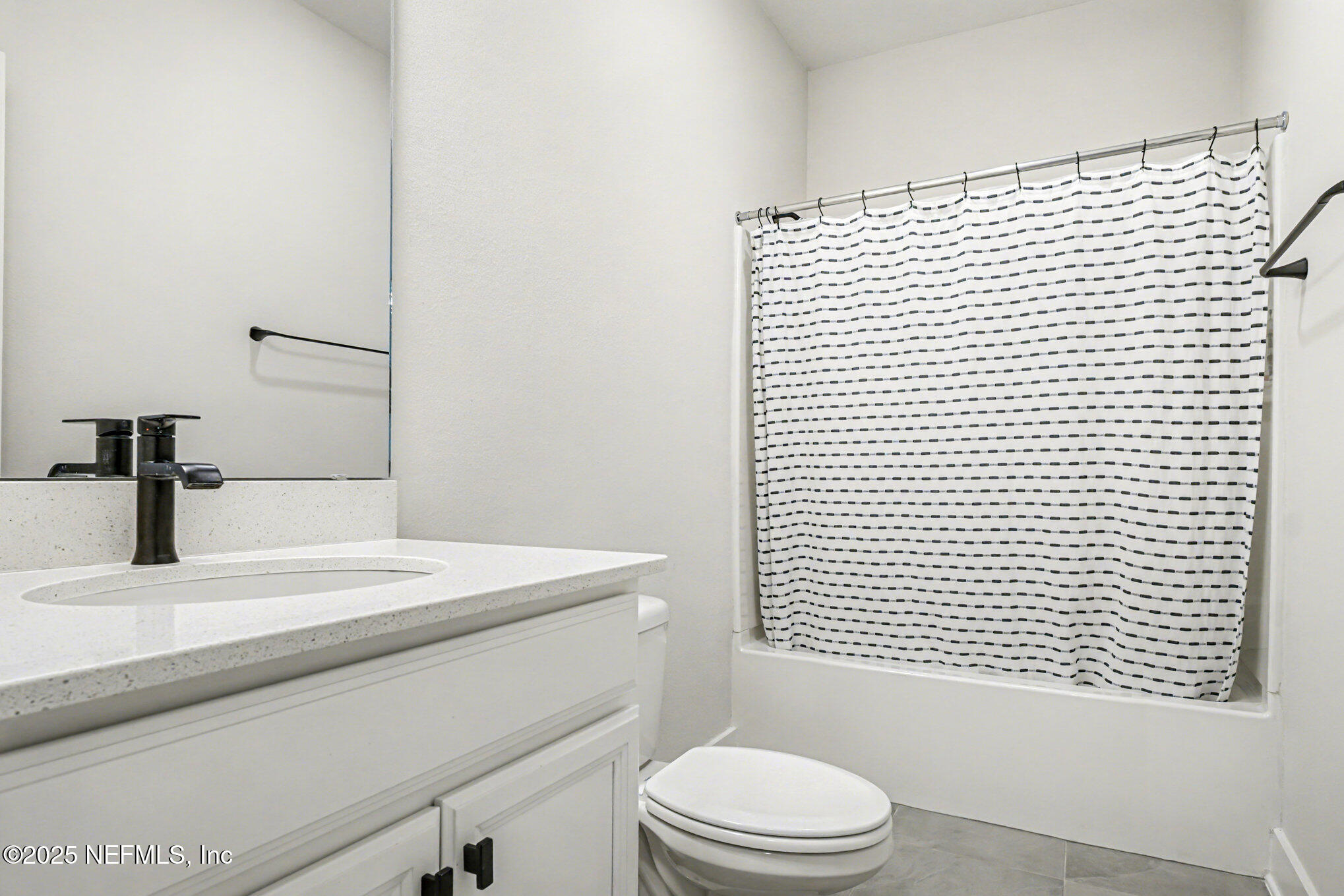 9858 Element Road Jacksonville, FL 32256 - Photo 7 of 19 a bathroom with a sink a toilet and shower