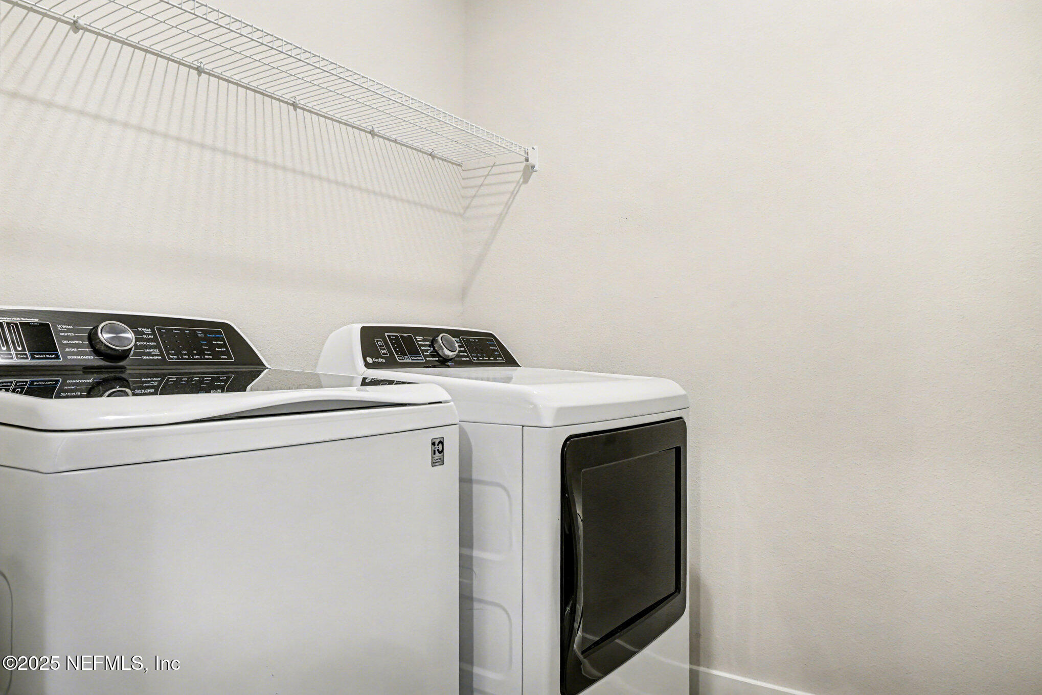 9858 Element Road Jacksonville, FL 32256 - Photo 10 of 19 a utility room with dryer and washer
