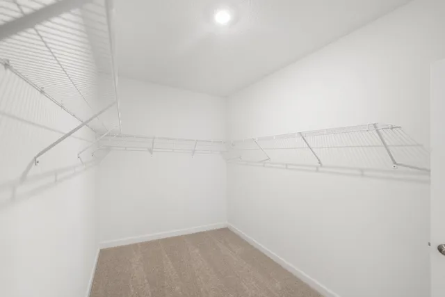 an empty room with a fan