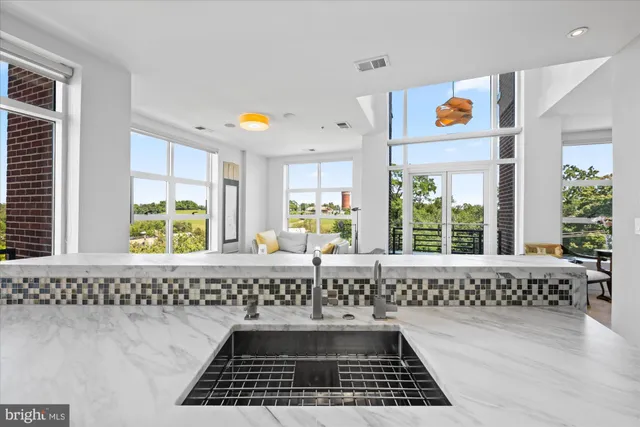 a bathroom with a window a bathtub and a shower