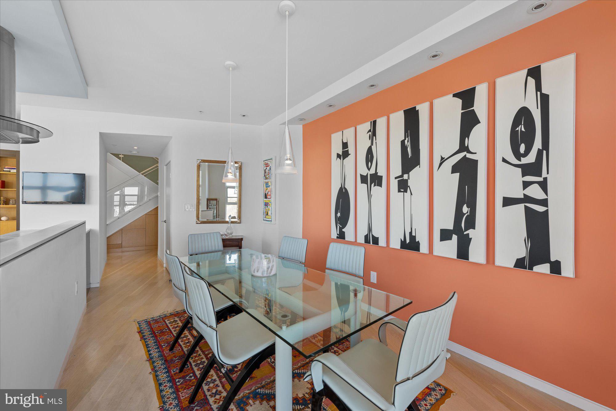 4750 41st Street Northwest, Unit 507 Washington, DC 20016 - Photo 7 of 55 a dining room with furniture and wooden floor