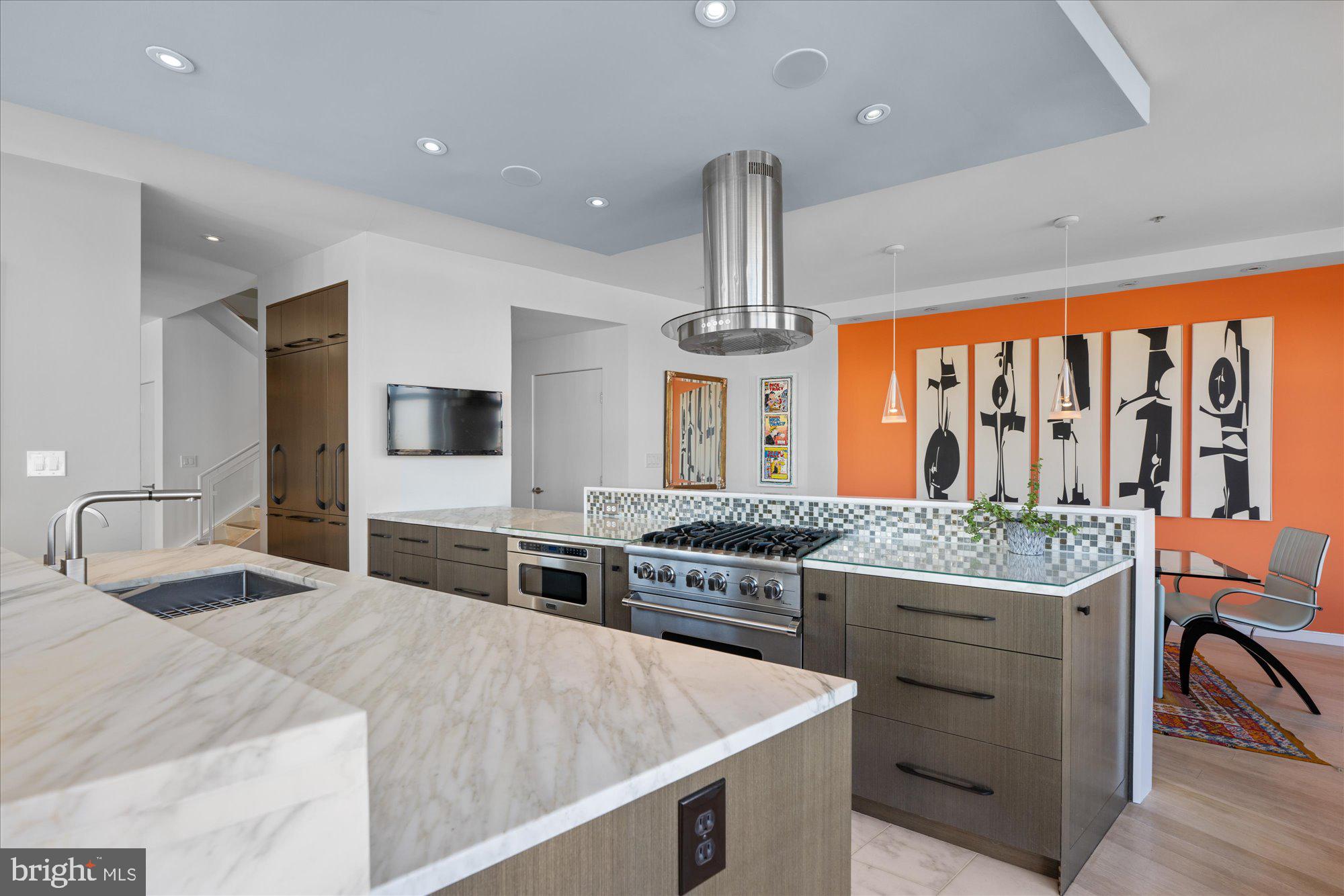 4750 41st Street Northwest, Unit 507 Washington, DC 20016 - Photo 9 of 55 a kitchen with stainless steel appliances a stove and more cabinets