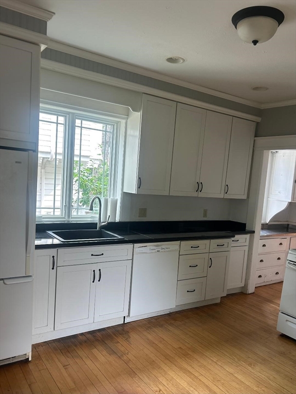 19 Wellesley Road Holyoke, MA 01040 - Photo 5 of 27 a kitchen with granite countertop white cabinets and sink