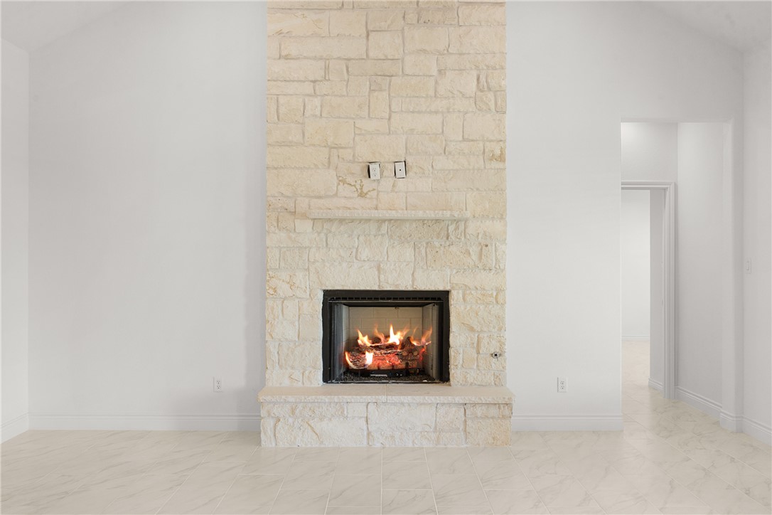 6512 Agave Court Bryan, TX 77808 - Photo 26 of 42 Detailed view of a fireplace and baseboards