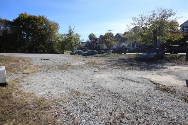 a view of a street with a yard