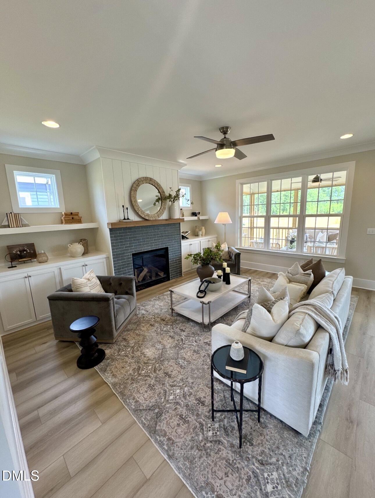 1057 Azalea Garden Circle Raleigh, NC 27603 - Photo 7 of 20 a living room with furniture a rug and a chandelier