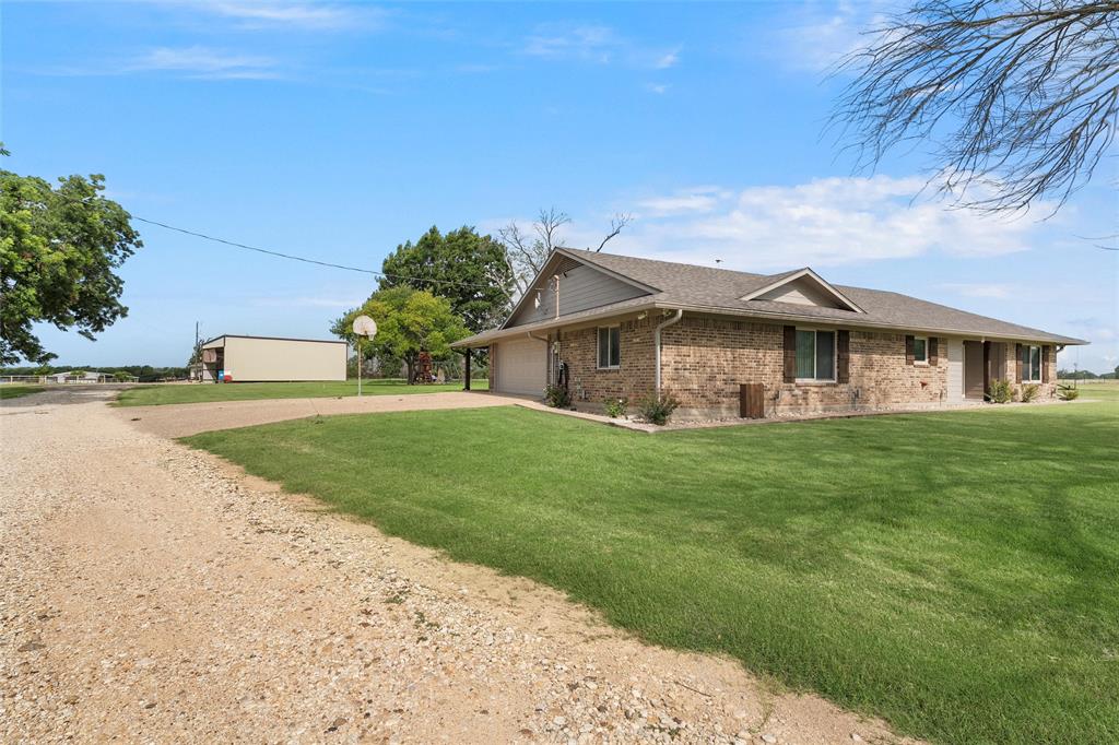 11541 Old Dallas Road West, TX 76691 - Photo 26 of 39 a view of a house with a big yard