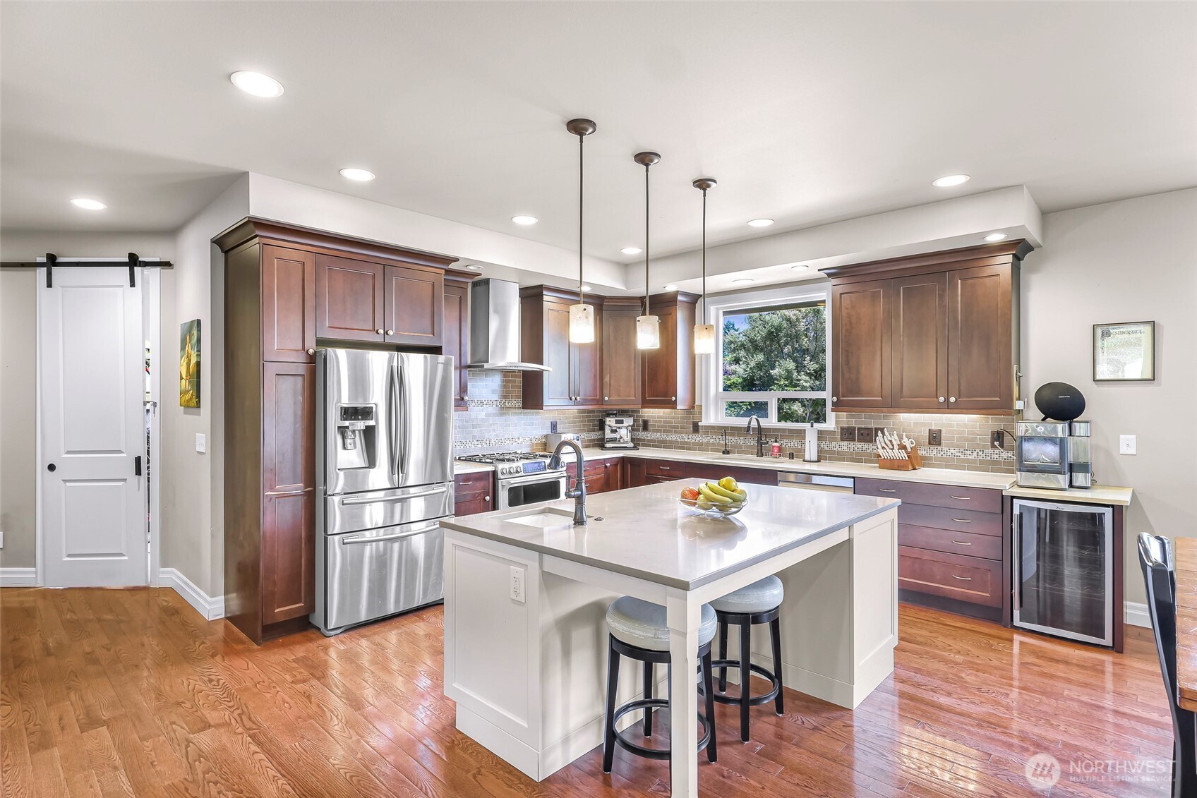 1301 Broad Street Bellingham, WA 98229 - Photo 15 of 40 a kitchen with refrigerator and chairs