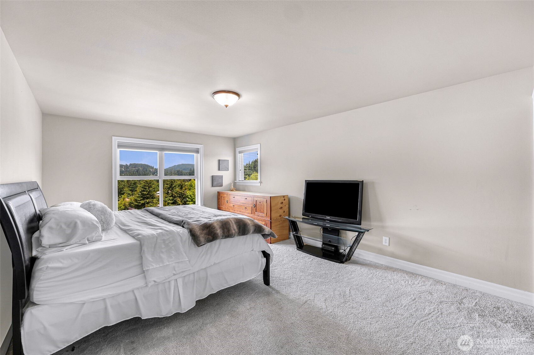 1301 Broad Street Bellingham, WA 98229 - Photo 27 of 40 a bedroom with a bed and tv