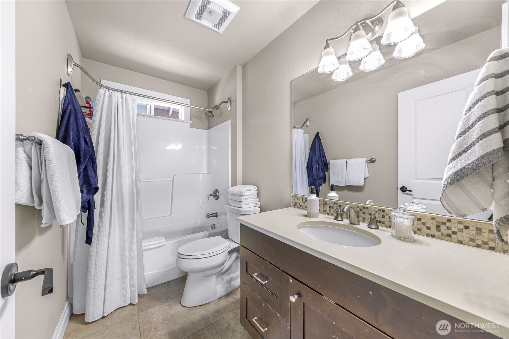 1301 Broad Street Bellingham, WA 98229 - Photo 31 of 40 a bathroom with a double vanity sink mirror and toilet