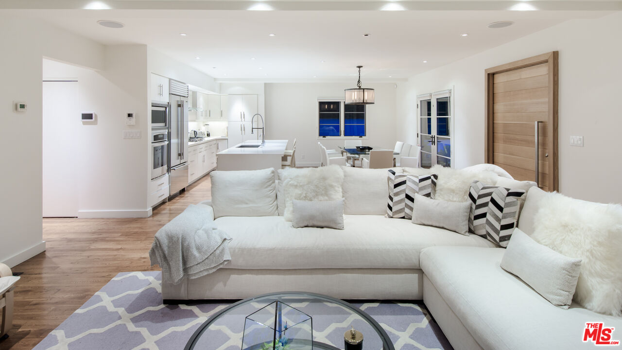 441 North Kings Road Los Angeles, CA 90048 - Photo 14 of 36 a living room with furniture white walls and white walls