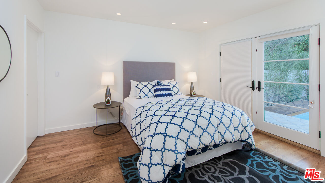 441 North Kings Road Los Angeles, CA 90048 - Photo 18 of 36 a bedroom with a bed and a window