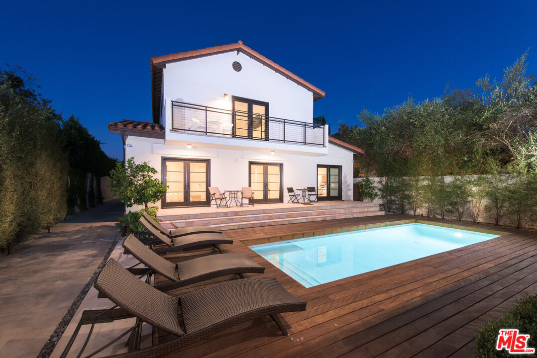 441 North Kings Road Los Angeles, CA 90048 - Photo 4 of 36 a view of house with swimming pool outdoor seating