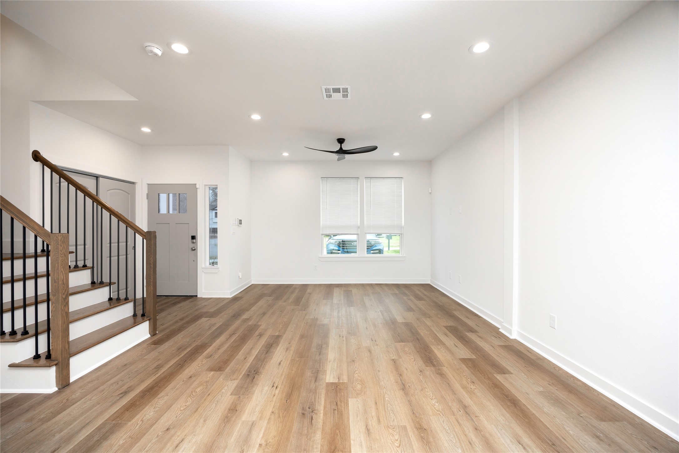 2753 Redrock Street, Unit B Houston, TX 77088 - Photo 11 of 35 a view of a hallway with wooden floor and windows