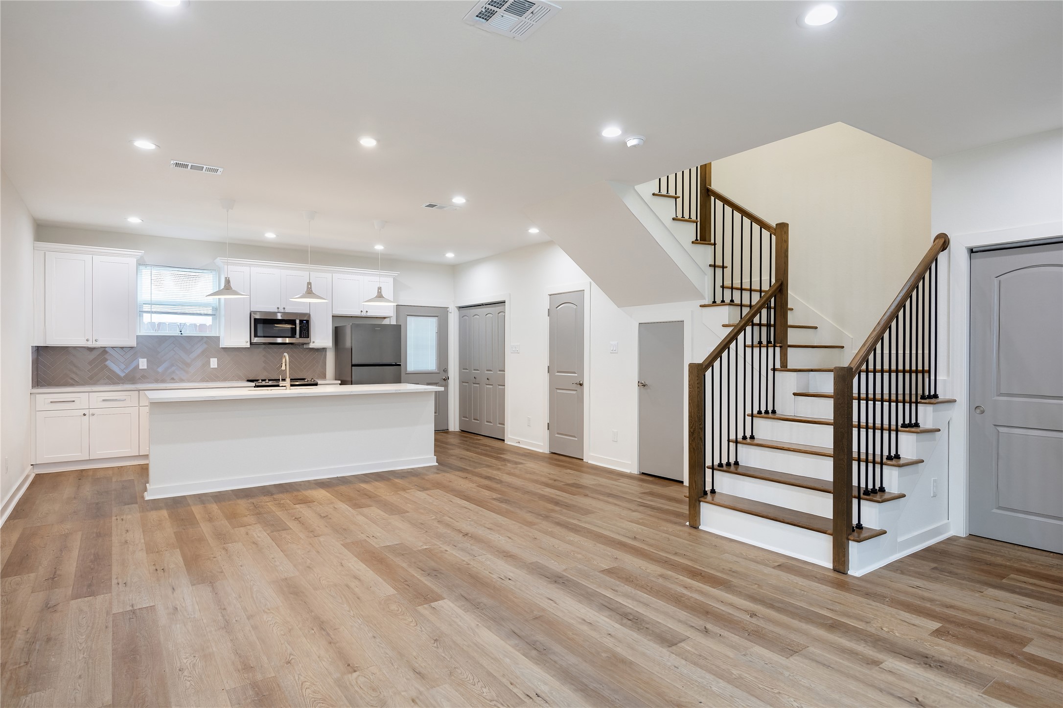 2753 Redrock Street, Unit B Houston, TX 77088 - Photo 12 of 35 a view of kitchen with wooden floor and electronic appliances