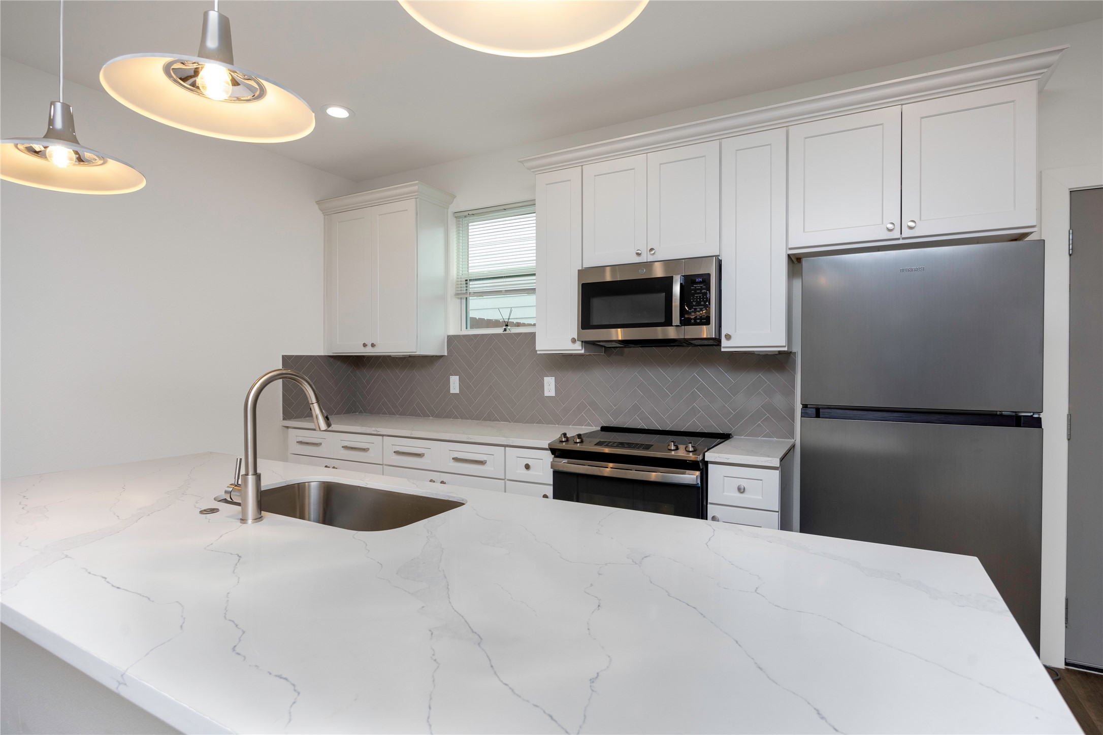 2753 Redrock Street, Unit B Houston, TX 77088 - Photo 15 of 35 a kitchen with stainless steel appliances granite countertop a refrigerator a stove a sink and a stove