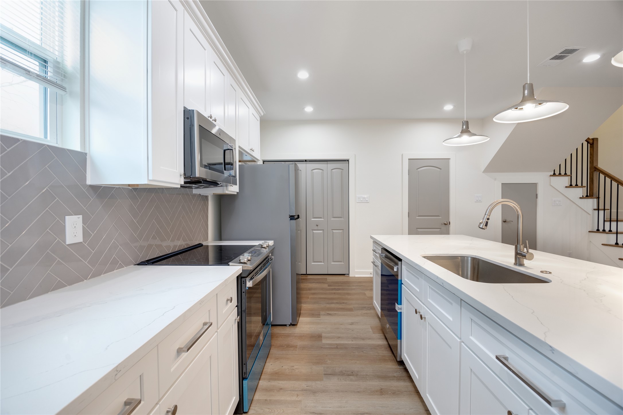 2753 Redrock Street, Unit B Houston, TX 77088 - Photo 18 of 35 a kitchen that has a sink and a stove in it