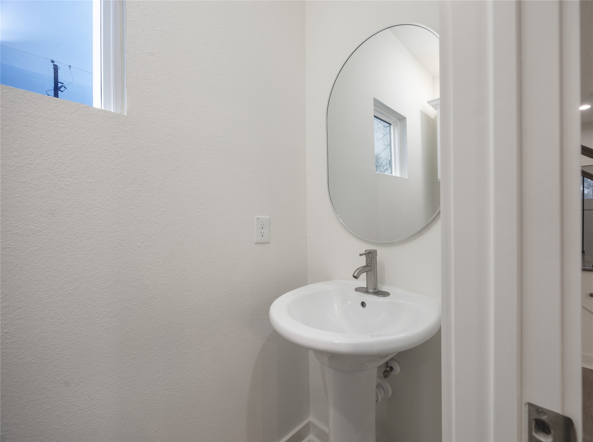 2753 Redrock Street, Unit B Houston, TX 77088 - Photo 20 of 35 a bathroom with a sink and a mirror