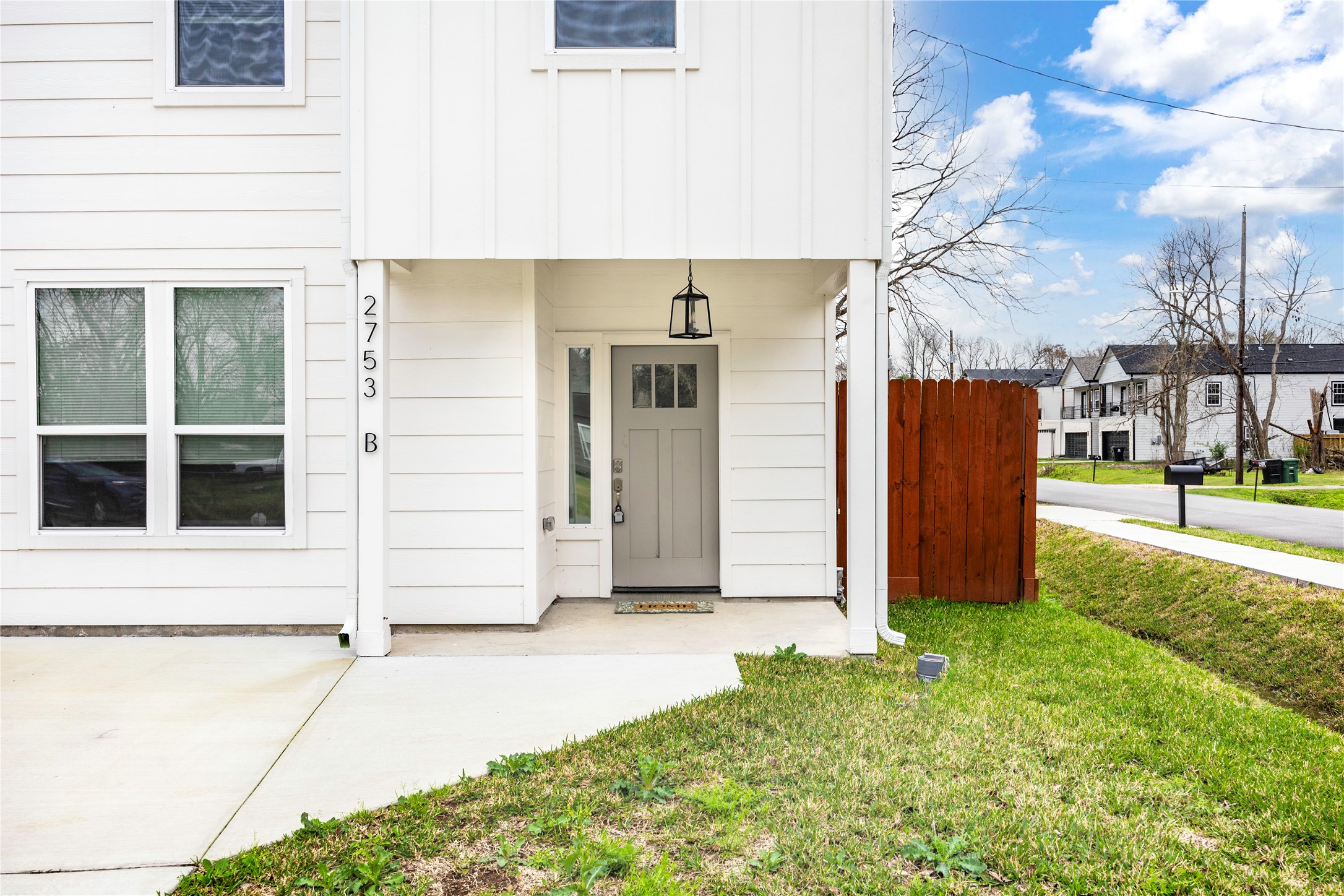 2753 Redrock Street, Unit B Houston, TX 77088 - Photo 2 of 35 a front view of a house with a garden