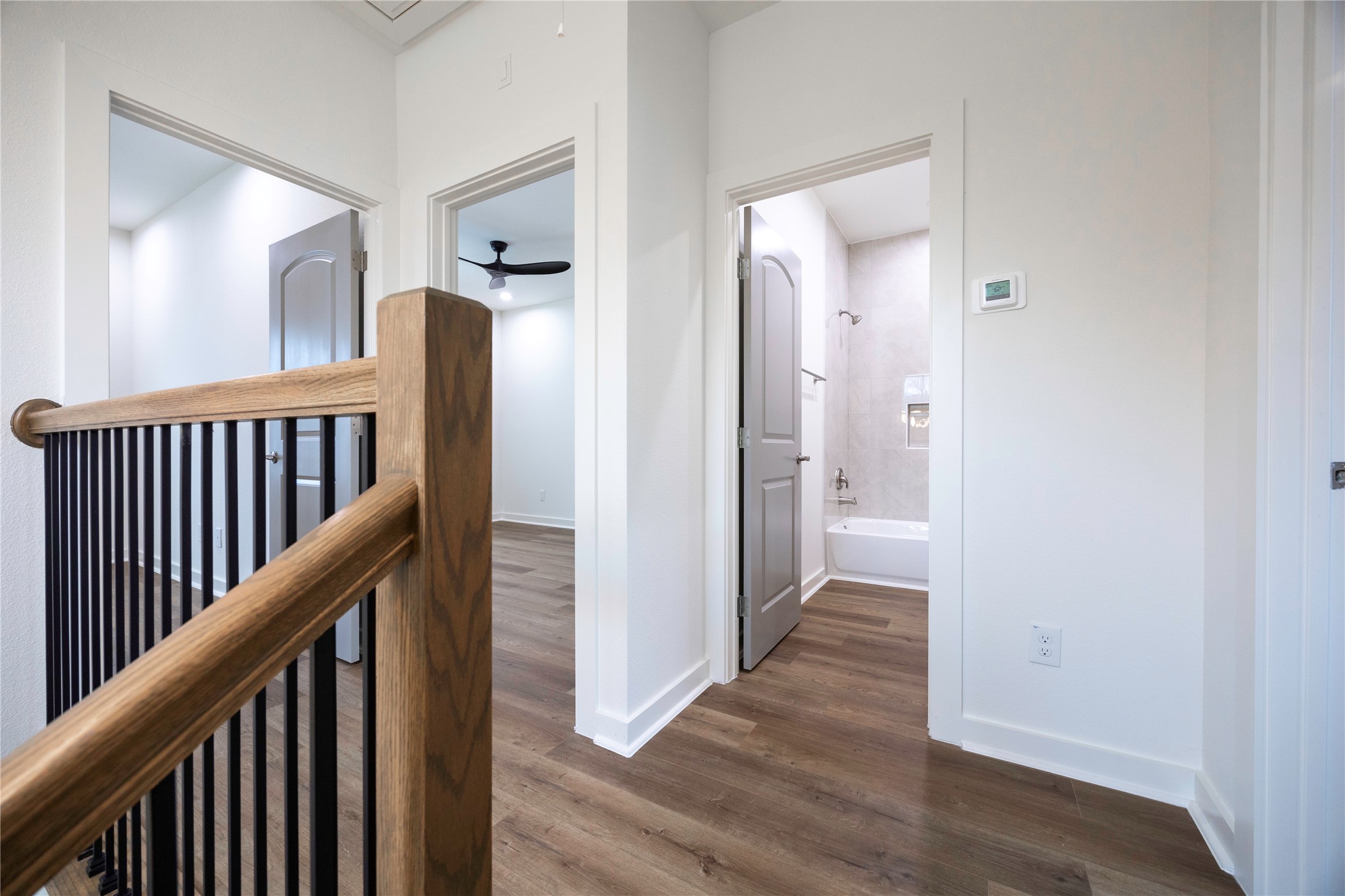 2753 Redrock Street, Unit B Houston, TX 77088 - Photo 21 of 35 a view of a hallway with wooden floor and stairs