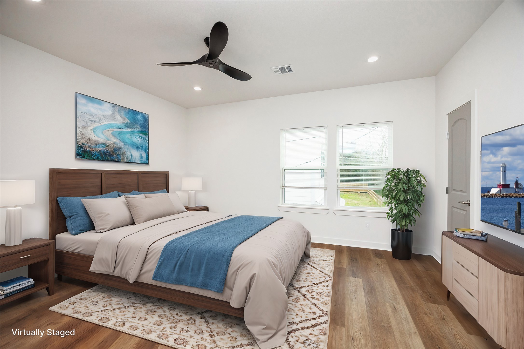 2753 Redrock Street, Unit B Houston, TX 77088 - Photo 24 of 35 a bedroom with a large bed and a chandelier