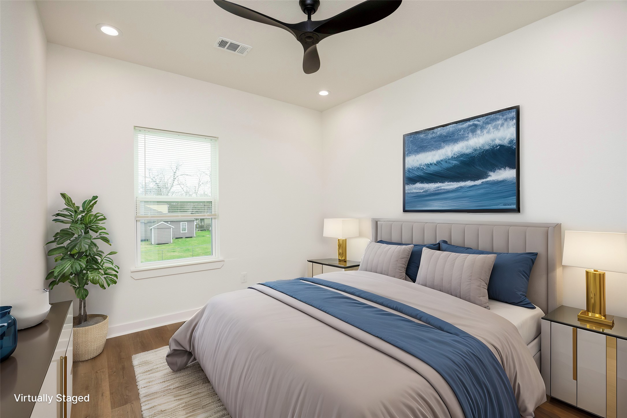 2753 Redrock Street, Unit B Houston, TX 77088 - Photo 30 of 35 a bedroom with a bed and a potted plant