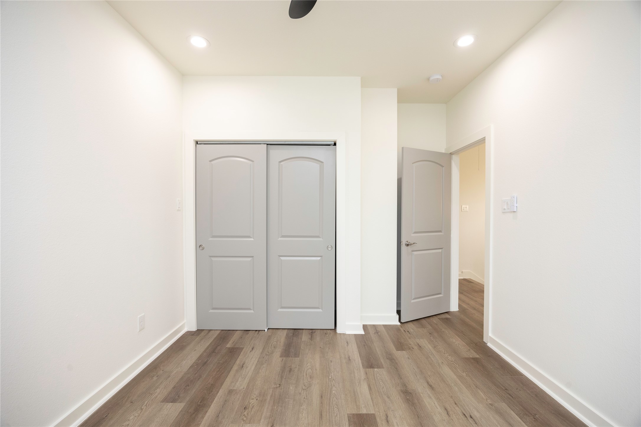2753 Redrock Street, Unit B Houston, TX 77088 - Photo 31 of 35 an empty room with wooden floor and closet