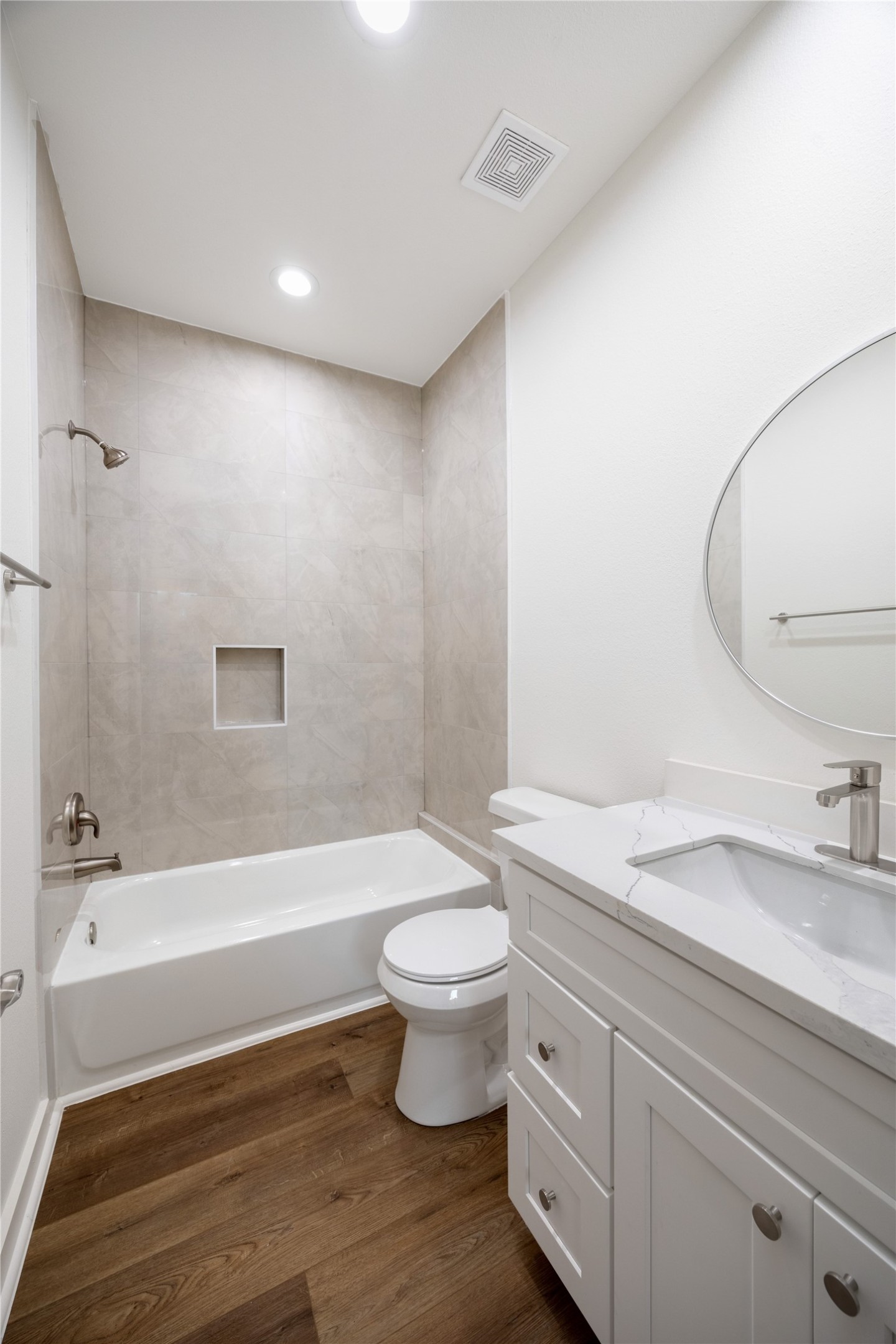 2753 Redrock Street, Unit B Houston, TX 77088 - Photo 32 of 35 a bathroom with a granite countertop sink a toilet and a bathtub