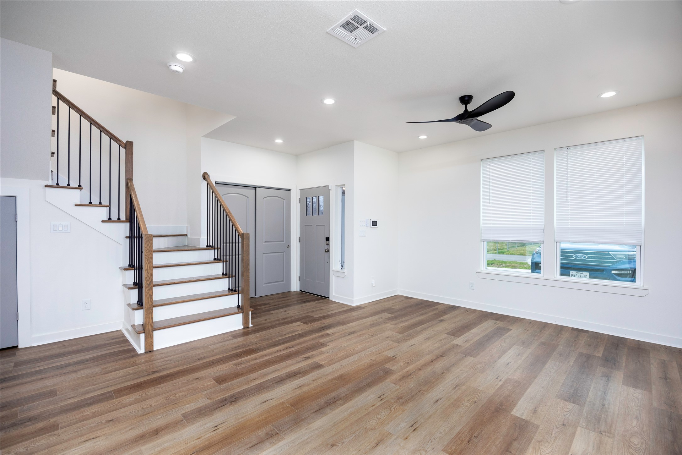 2753 Redrock Street, Unit B Houston, TX 77088 - Photo 7 of 35 a view of an empty room with wooden floor and a window