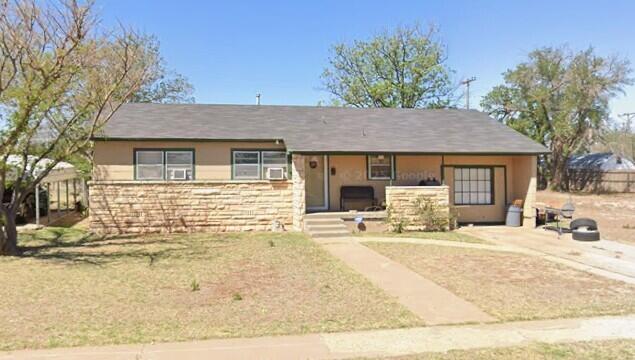 a front view of a house with a outdoor space