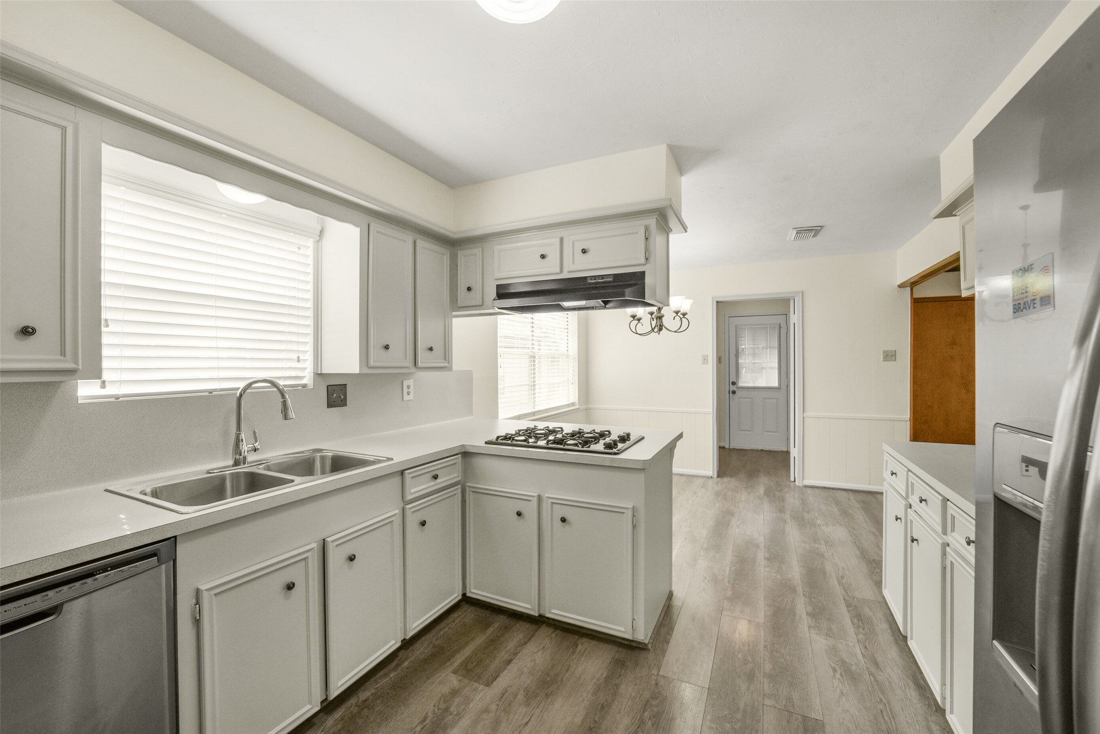 7818 Kleingreen Lane Spring, TX 77379 - Photo 19 of 50 a kitchen with stainless steel appliances granite countertop a sink stove and refrigerator