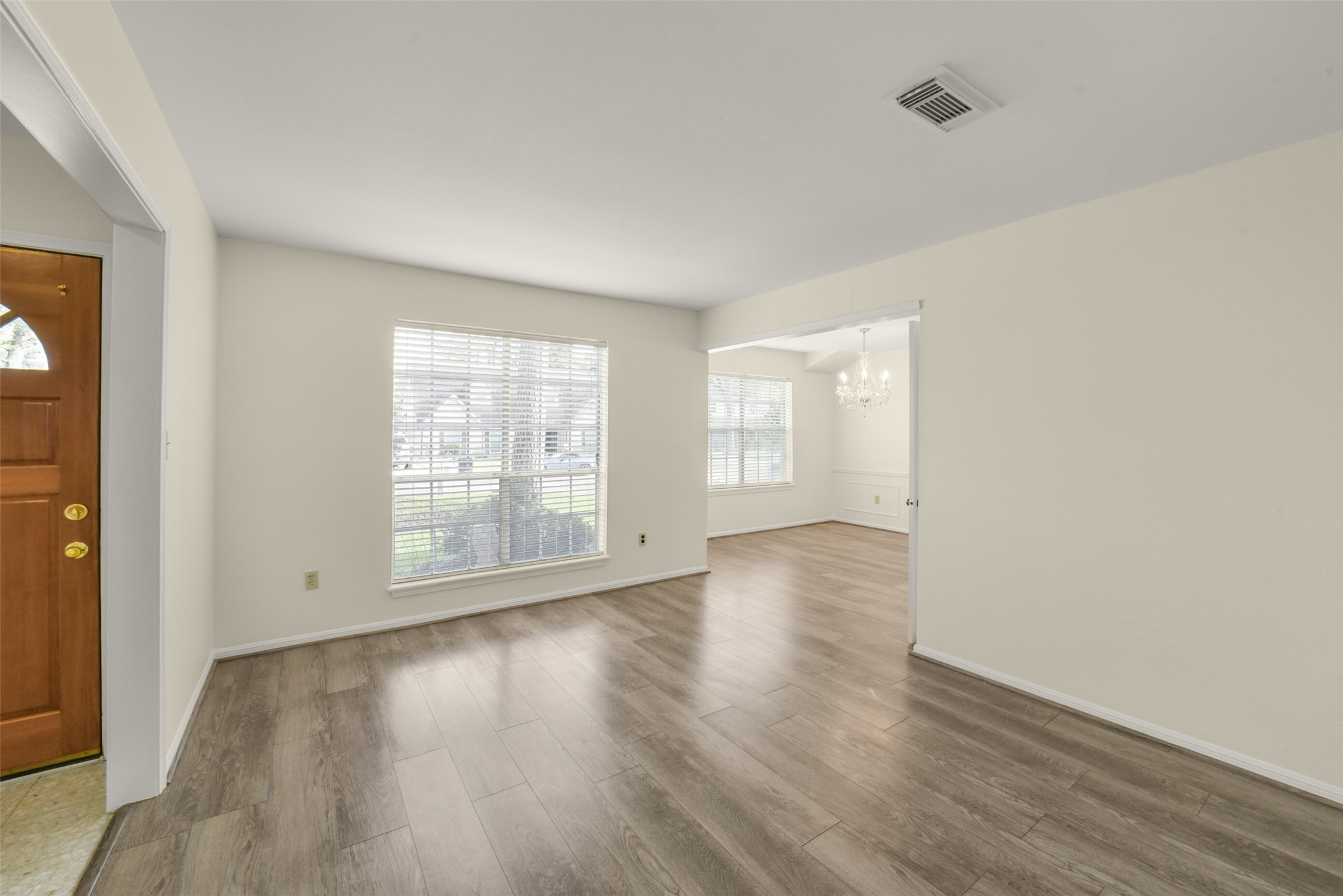7818 Kleingreen Lane Spring, TX 77379 - Photo 27 of 50 an empty room with wooden floor and windows