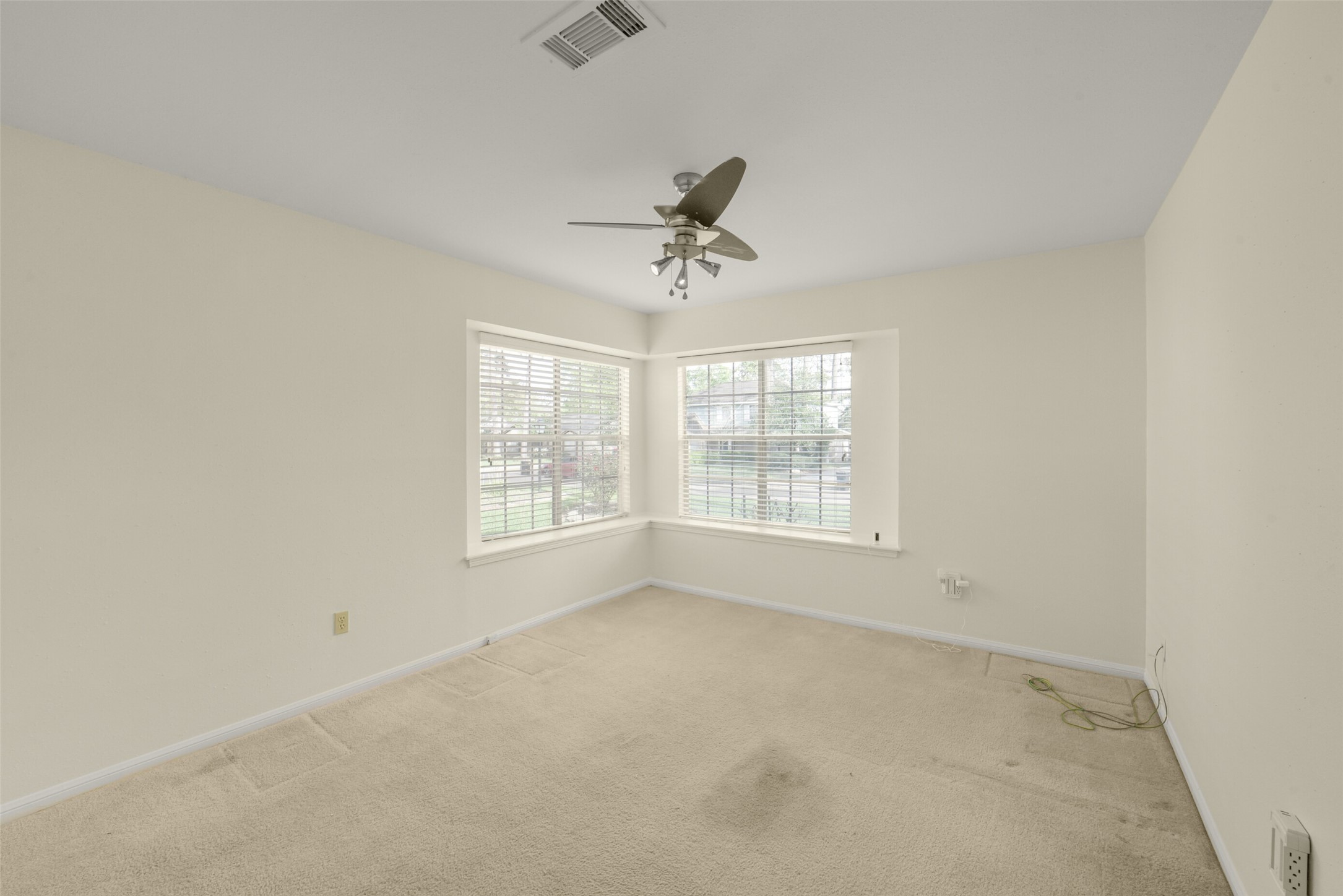 7818 Kleingreen Lane Spring, TX 77379 - Photo 31 of 50 an empty room with a window and a ceiling fan