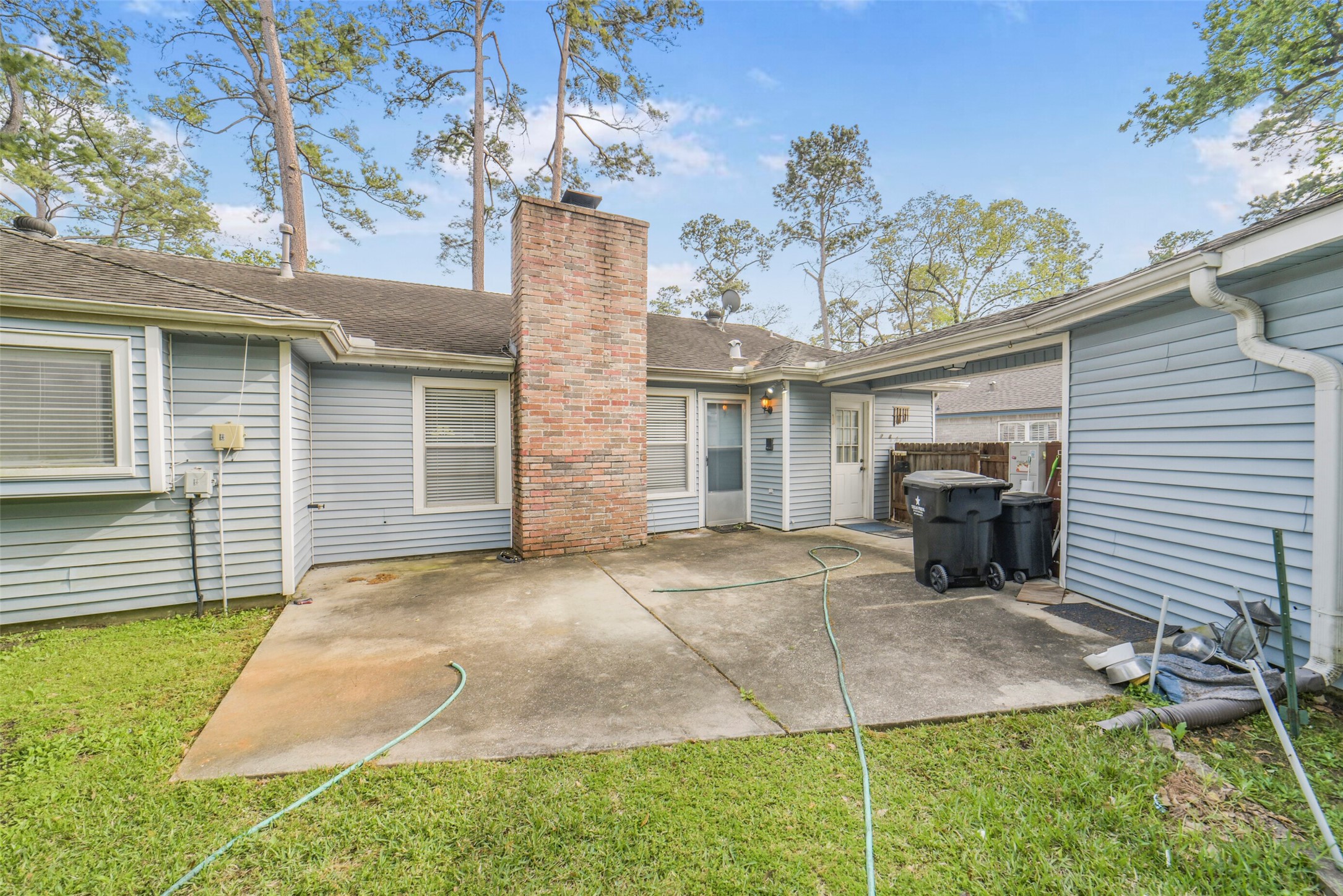 7818 Kleingreen Lane Spring, TX 77379 - Photo 47 of 50 a view of a house with a patio and a yard