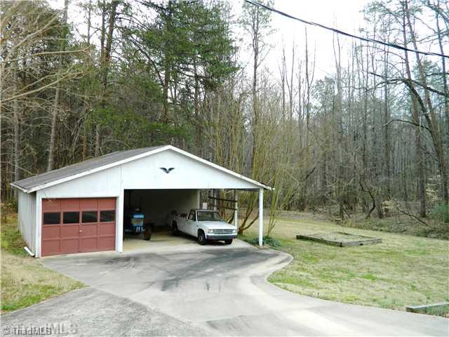 6904 Aplington Road Oak Ridge, NC 27310 - Photo 2 of 14 Parking Lot/Garage. Detached one car garage with attached 2 car carport. Perfect Workshop!