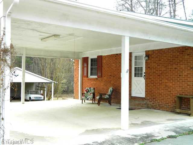 6904 Aplington Road Oak Ridge, NC 27310 - Photo 3 of 14 Parking Lot/Garage. Two car attached carport with pull down floored storage above.