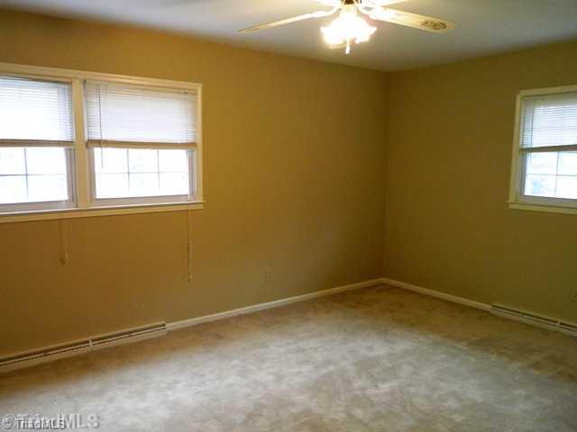 6904 Aplington Road Oak Ridge, NC 27310 - Photo 7 of 14 Master Bedroom. Master Bedroom has adjoining good size closet and full bath with his and hers sinks. Windows are newer and with blinds.