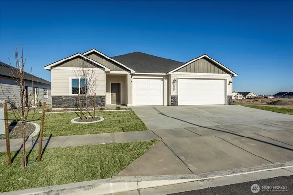 a view of a front of a house with a yard