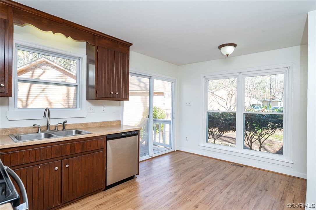 3022 3 Bridges Road Midlothian, VA 23112 - Photo 12 of 26 a kitchen with a sink a window and wooden floor