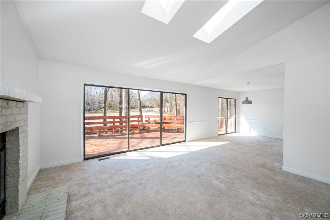 3022 3 Bridges Road Midlothian, VA 23112 - Photo 6 of 26 a view of an empty room with a fireplace and a window