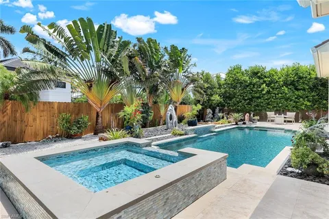a view of a swimming pool with a patio